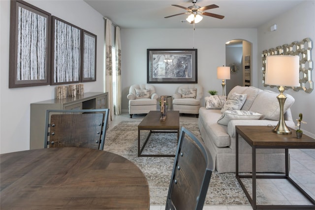 214 Emerald Thicket Ln, Humble, TX 77336 - tiled living room with arched walkways and a ceiling fan