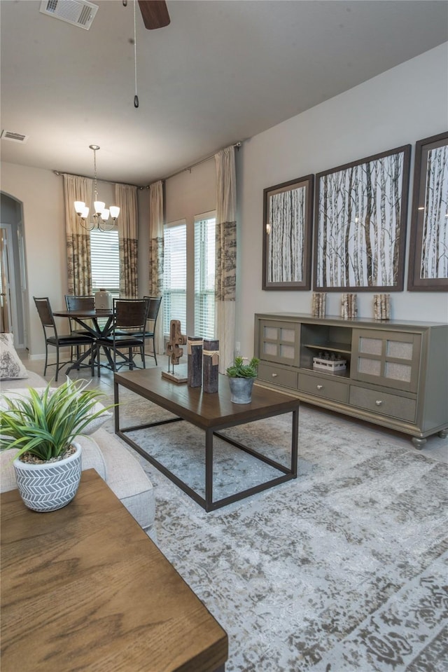 214 Emerald Thicket Ln, Humble, TX 77336 - living area featuring a ceiling fan and a chandelier