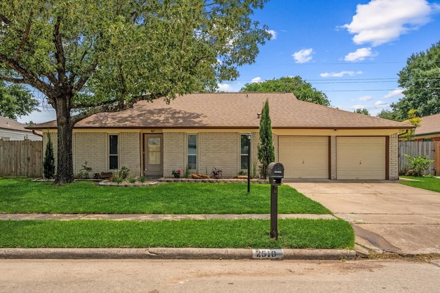 2510 Leichester Dr, Spring, TX 77386 - ranch-style house with a garage, driveway, and brick siding