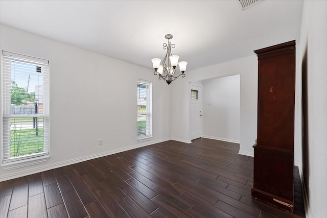 2510 Leichester Dr, Spring, TX 77386 - empty room with a chandelier, baseboards, and dark wood-style flooring