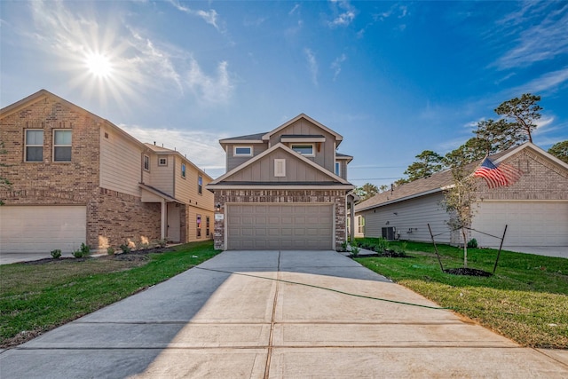 24705 Thornbluff Briar Trl, Huffman, TX 77336 - view of front of property featuring board and batten siding, a front yard, a garage, cooling unit, and brick siding