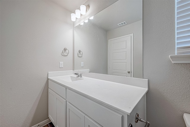 24705 Thornbluff Briar Trl, Huffman, TX 77336 - bathroom featuring vanity and a textured wall