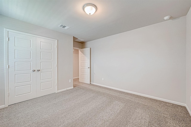 24705 Thornbluff Briar Trl, Huffman, TX 77336 - unfurnished bedroom with carpet floors, a closet, and baseboards