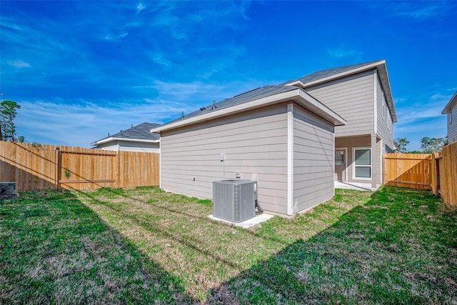 24705 Thornbluff Briar Trl, Huffman, TX 77336 - rear view of property with central air condition unit