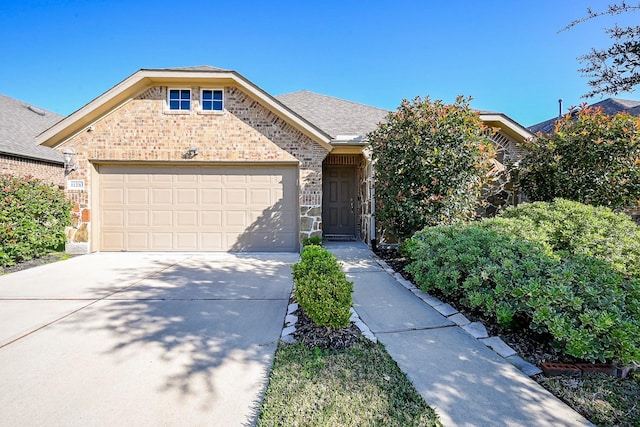 11210 Victoria Hollow Trce, Richmond, TX 77406 - view of front of home with brick siding, a garage, and concrete driveway