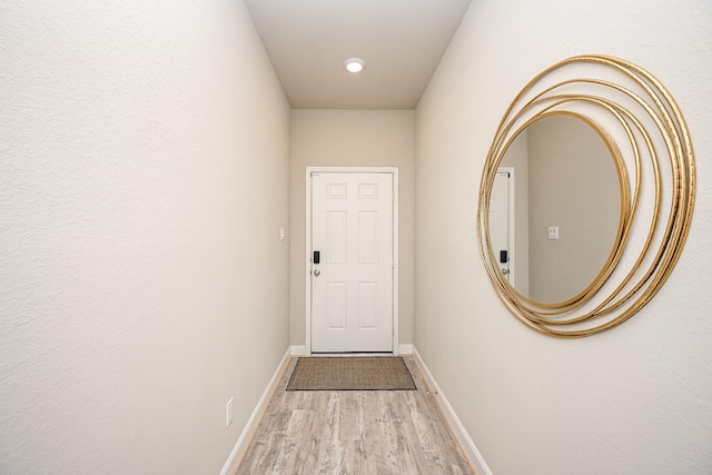11210 Victoria Hollow Trce, Richmond, TX 77406 - doorway to outside with wood finished floors, baseboards, and recessed lighting