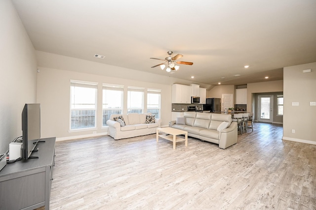 11210 Victoria Hollow Trce, Richmond, TX 77406 - living room with light wood-type flooring, a ceiling fan, baseboards, and recessed lighting