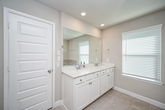 11210 Victoria Hollow Trce, Richmond, TX 77406 - full bathroom featuring double vanity, baseboards, tile patterned flooring, and recessed lighting