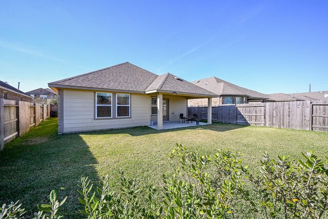 11210 Victoria Hollow Trce, Richmond, TX 77406 - back of property with roof with shingles and a patio