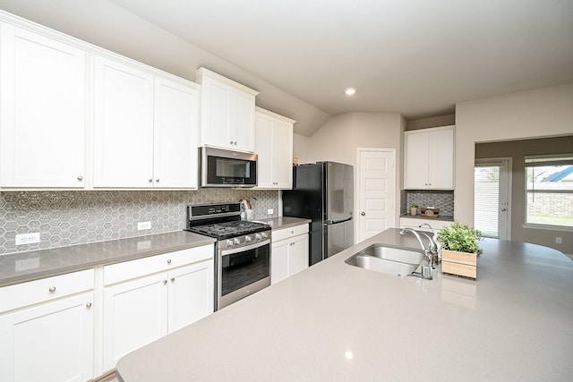 11210 Victoria Hollow Trce, Richmond, TX 77406 - kitchen featuring stainless steel appliances, a sink, white cabinetry, and recessed lighting