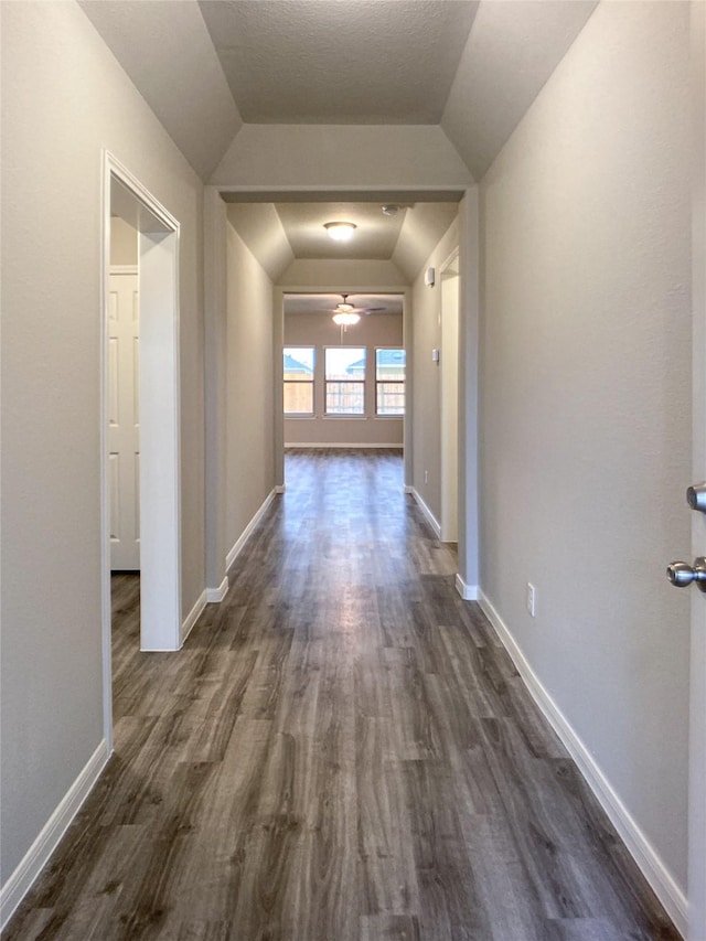 27203 Blue Pool Dr, Katy, TX 77493 - hallway featuring lofted ceiling, dark wood-style floors, and baseboards
