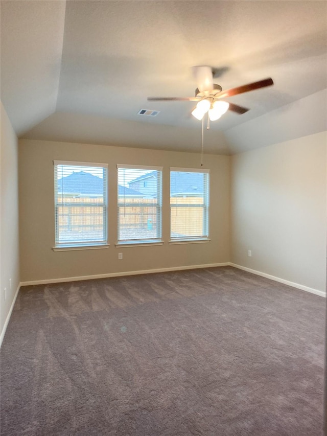 27203 Blue Pool Dr, Katy, TX 77493 - empty room with a ceiling fan, lofted ceiling, dark colored carpet, and baseboards