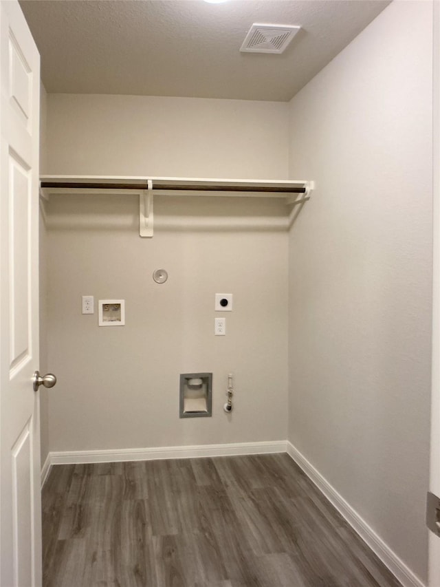 27203 Blue Pool Dr, Katy, TX 77493 - washroom with hookup for a gas dryer, electric dryer hookup, dark wood finished floors, baseboards, and hookup for a washing machine
