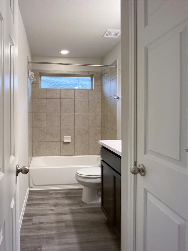 27203 Blue Pool Dr, Katy, TX 77493 - full bath featuring toilet, vanity, wood finished floors, shower / washtub combination, and recessed lighting