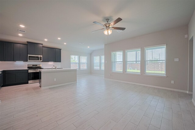 27203 Blue Pool Dr, Katy, TX 77493 - kitchen featuring appliances with stainless steel finishes, open floor plan, a sink, ceiling fan, and recessed lighting