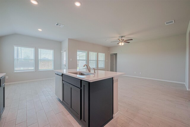 27203 Blue Pool Dr, Katy, TX 77493 - kitchen with a sink, stainless steel dishwasher, ceiling fan, light countertops, and light wood-style floors
