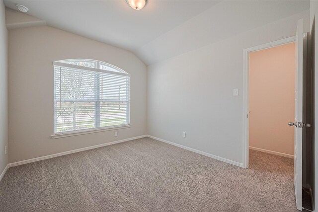 27203 Blue Pool Dr, Katy, TX 77493 - unfurnished room featuring a smoke detector, carpet flooring, baseboards, and lofted ceiling