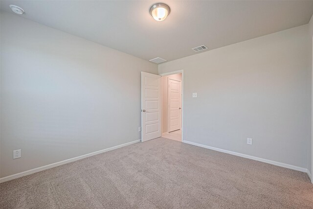 27203 Blue Pool Dr, Katy, TX 77493 - empty room with light colored carpet, baseboards, and a smoke detector