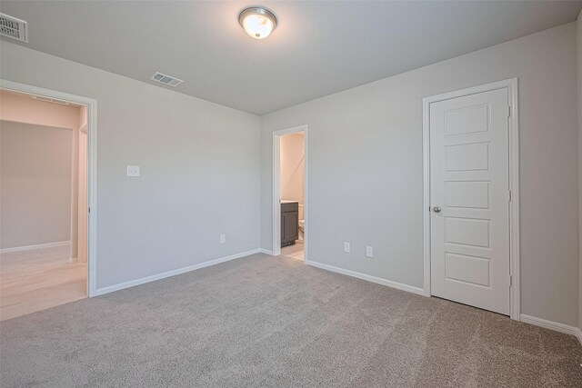 27203 Blue Pool Dr, Katy, TX 77493 - unfurnished bedroom featuring carpet floors, baseboards, and connected bathroom
