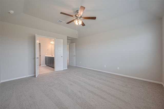 27203 Blue Pool Dr, Katy, TX 77493 - unfurnished bedroom featuring light carpet, baseboards, vaulted ceiling, and ensuite bathroom