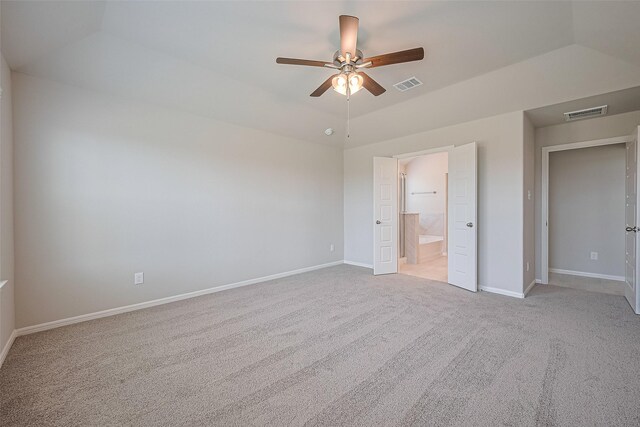 27203 Blue Pool Dr, Katy, TX 77493 - unfurnished bedroom featuring light carpet, baseboards, lofted ceiling, and ensuite bath