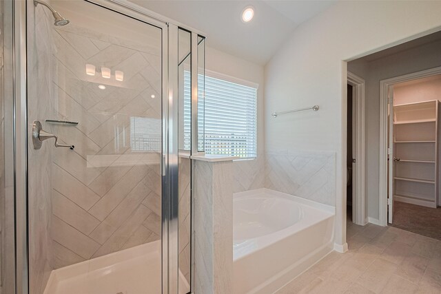 27203 Blue Pool Dr, Katy, TX 77493 - bathroom with a bath, a shower stall, and lofted ceiling