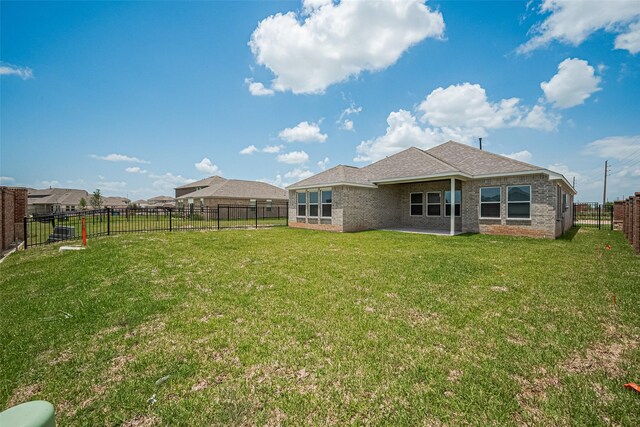 27203 Blue Pool Dr, Katy, TX 77493 - back of property featuring a patio and brick siding