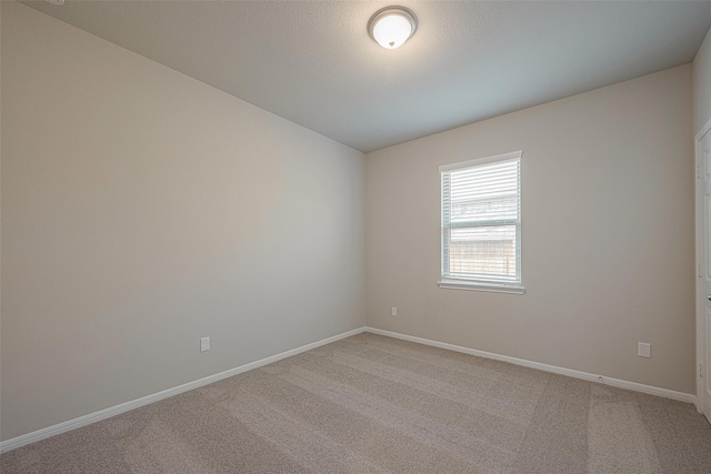 1464 Sundown Glen Ln, Katy, TX 77493 - empty room featuring light carpet and baseboards