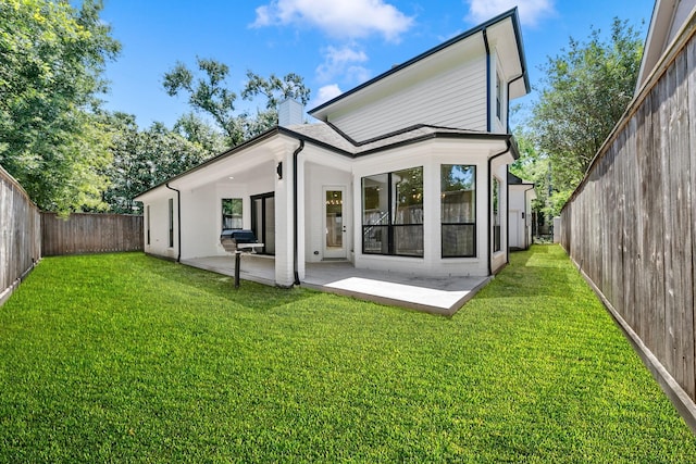 4528 S Evergreen St, Bellaire, TX 77401 - back of property with a chimney and a patio