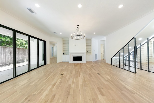 4528 S Evergreen St, Bellaire, TX 77401 - unfurnished living room featuring light wood finished floors, built in features, a chandelier, ornamental molding, and recessed lighting