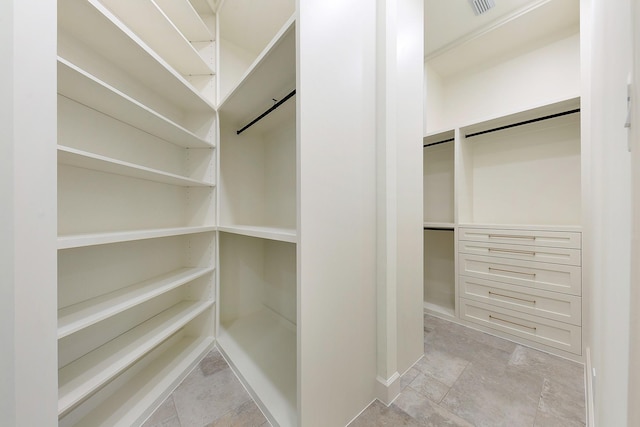 4528 S Evergreen St, Bellaire, TX 77401 - walk in closet featuring light stone finish floors