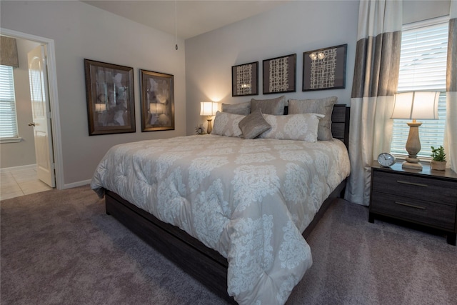 1472 Sundown Gln, Katy, TX 77493 - carpeted bedroom featuring baseboards and ensuite bath