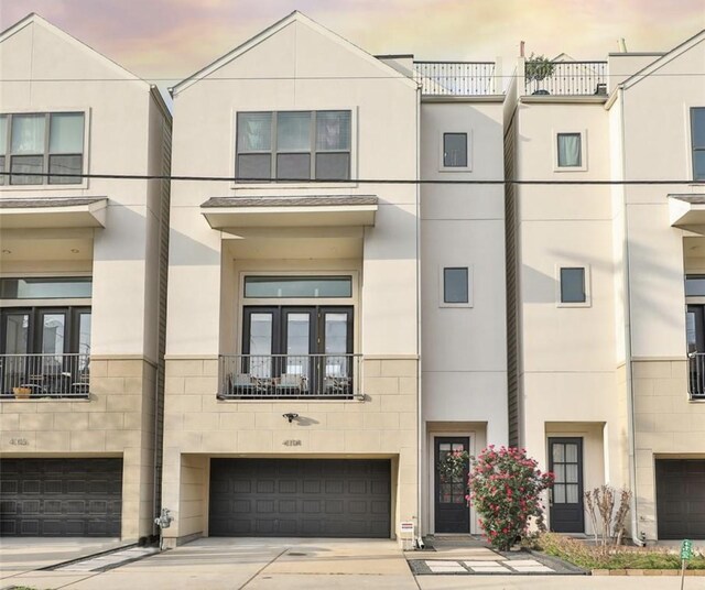 4104 Marina St, Houston, TX 77007 - view of property featuring an attached garage and concrete driveway