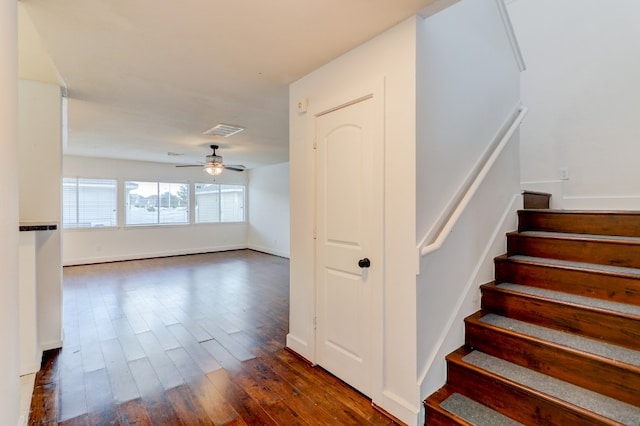 19603 Green Chase Ln, Houston, TX 77073 - stairway with wood finished floors and ceiling fan