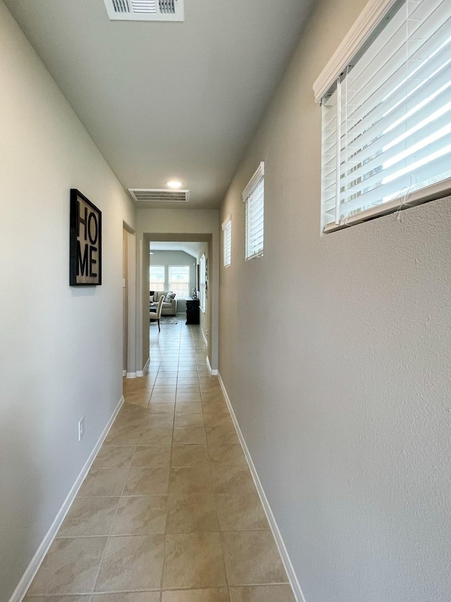 17807 Cappadocia Trl, Tomball, TX 77377 - hall with baseboards and light tile patterned flooring