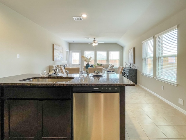 17807 Cappadocia Trl, Tomball, TX 77377 - kitchen featuring stainless steel dishwasher, a ceiling fan, light tile patterned flooring, a sink, and dark cabinets