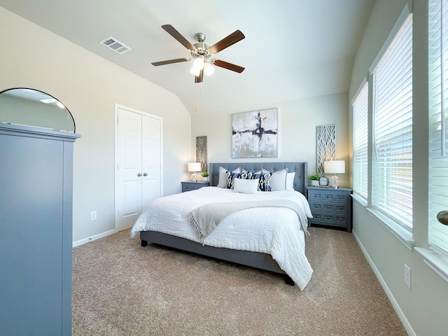 17807 Cappadocia Trl, Tomball, TX 77377 - carpeted bedroom featuring multiple windows, lofted ceiling, baseboards, and a ceiling fan