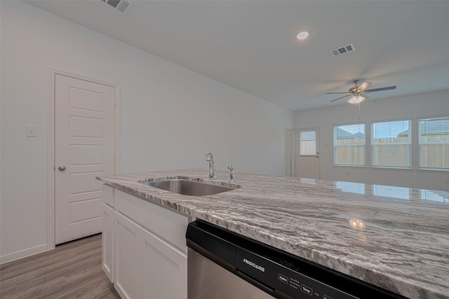 17807 Cappadocia Trl, Tomball, TX 77377 - kitchen featuring dishwasher, light stone countertops, white cabinetry, light wood-style flooring, and ceiling fan