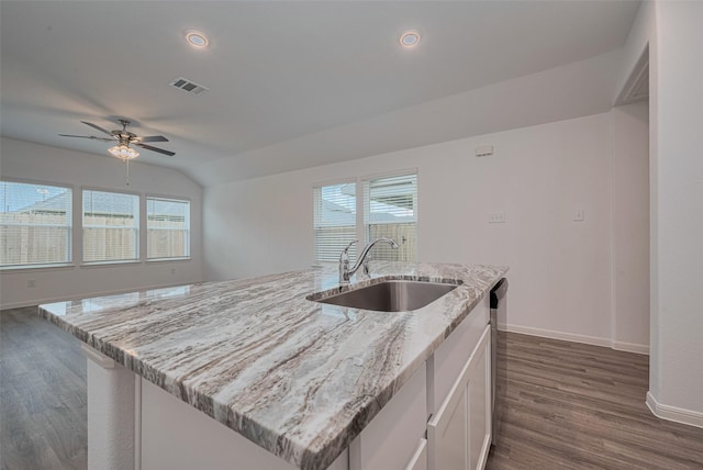 17807 Cappadocia Trl, Tomball, TX 77377 - kitchen featuring ceiling fan, dark wood-type flooring, white cabinets, healthy amount of natural light, and lofted ceiling