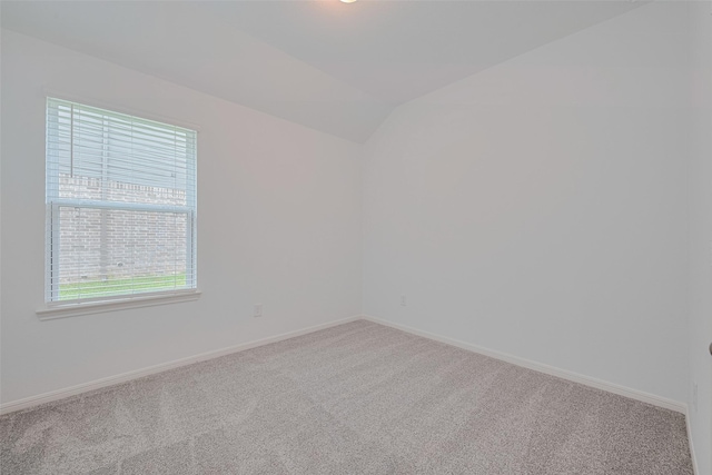 17807 Cappadocia Trl, Tomball, TX 77377 - empty room featuring carpet and lofted ceiling