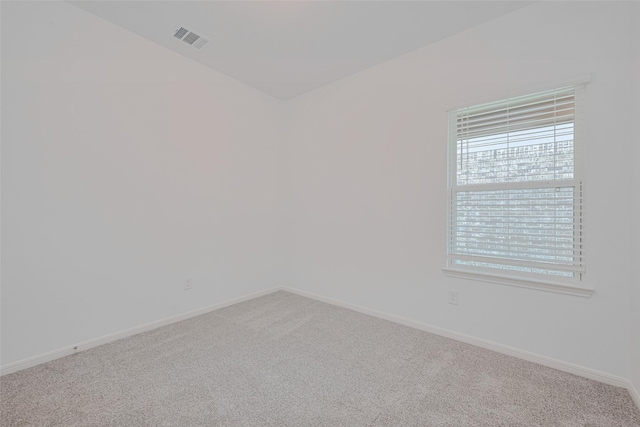 17807 Cappadocia Trl, Tomball, TX 77377 - spare room featuring carpet floors and healthy amount of natural light