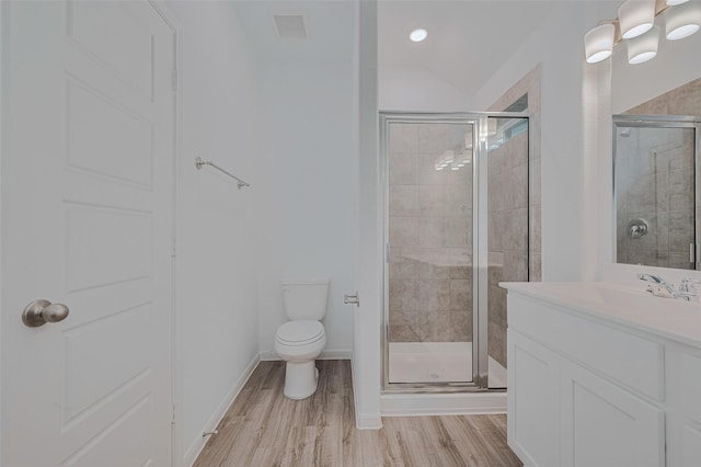 17807 Cappadocia Trl, Tomball, TX 77377 - bathroom with a shower stall, wood finished floors, and vanity