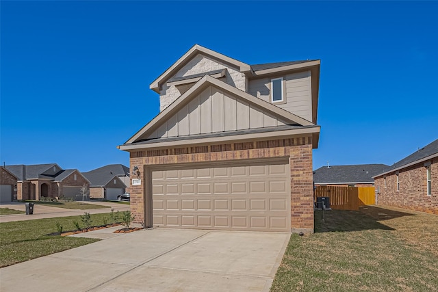 22807 Ephesus Ave, Tomball, TX 77377 - view of front of house featuring driveway, brick siding, a garage, and board and batten siding