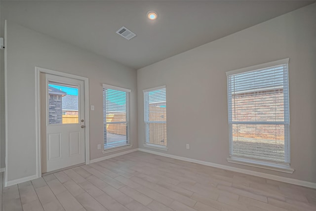 22807 Ephesus Ave, Tomball, TX 77377 - empty room featuring healthy amount of natural light, baseboards, and vaulted ceiling