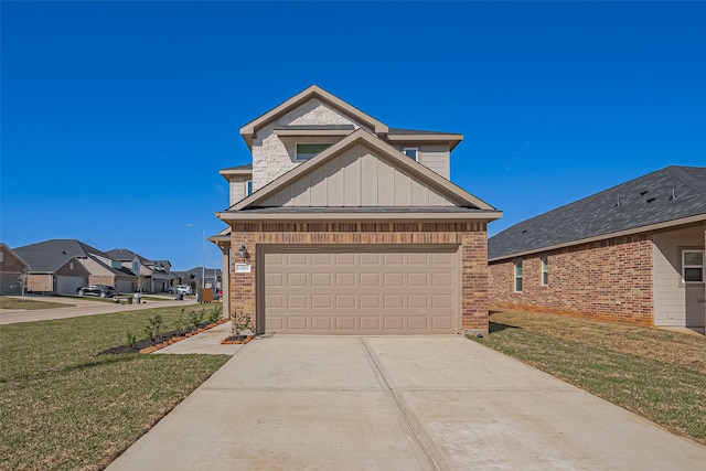 22807 Ephesus Ave, Tomball, TX 77377 - view of front of home with board and batten siding, brick siding, a front lawn, and concrete driveway