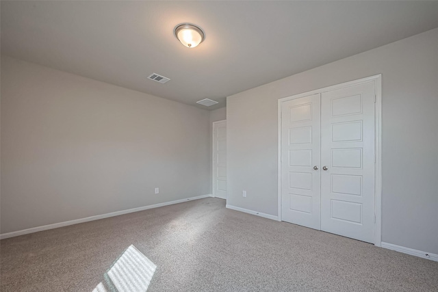 22807 Ephesus Ave, Tomball, TX 77377 - unfurnished bedroom with carpet flooring, a closet, and baseboards