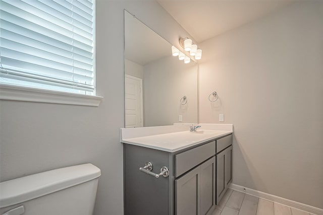 22807 Ephesus Ave, Tomball, TX 77377 - half bathroom with toilet, vanity, and baseboards