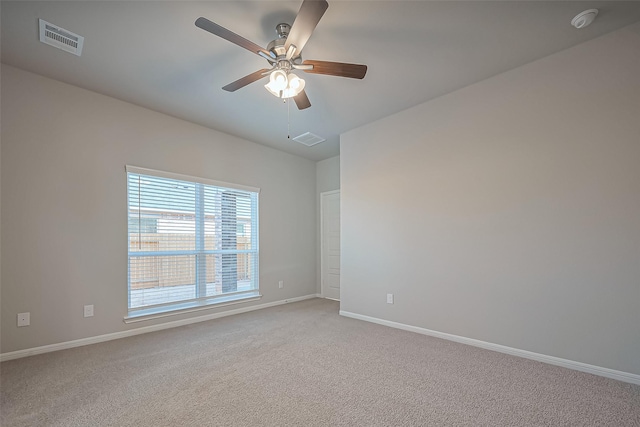 22807 Ephesus Ave, Tomball, TX 77377 - unfurnished room with light colored carpet, baseboards, a smoke detector, and a ceiling fan