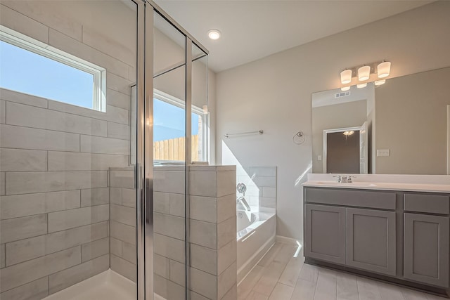22807 Ephesus Ave, Tomball, TX 77377 - full bath with a garden tub, vanity, a shower stall, and baseboards