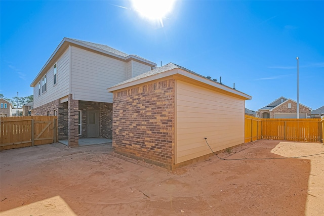 22807 Ephesus Ave, Tomball, TX 77377 - view of side of home with a patio and a fenced backyard